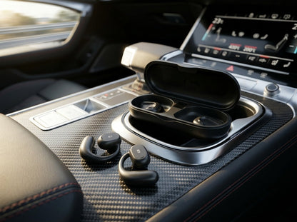 CTRL8 X29 open-ear headphones with charging case placed on a car console for seamless audio during travel
